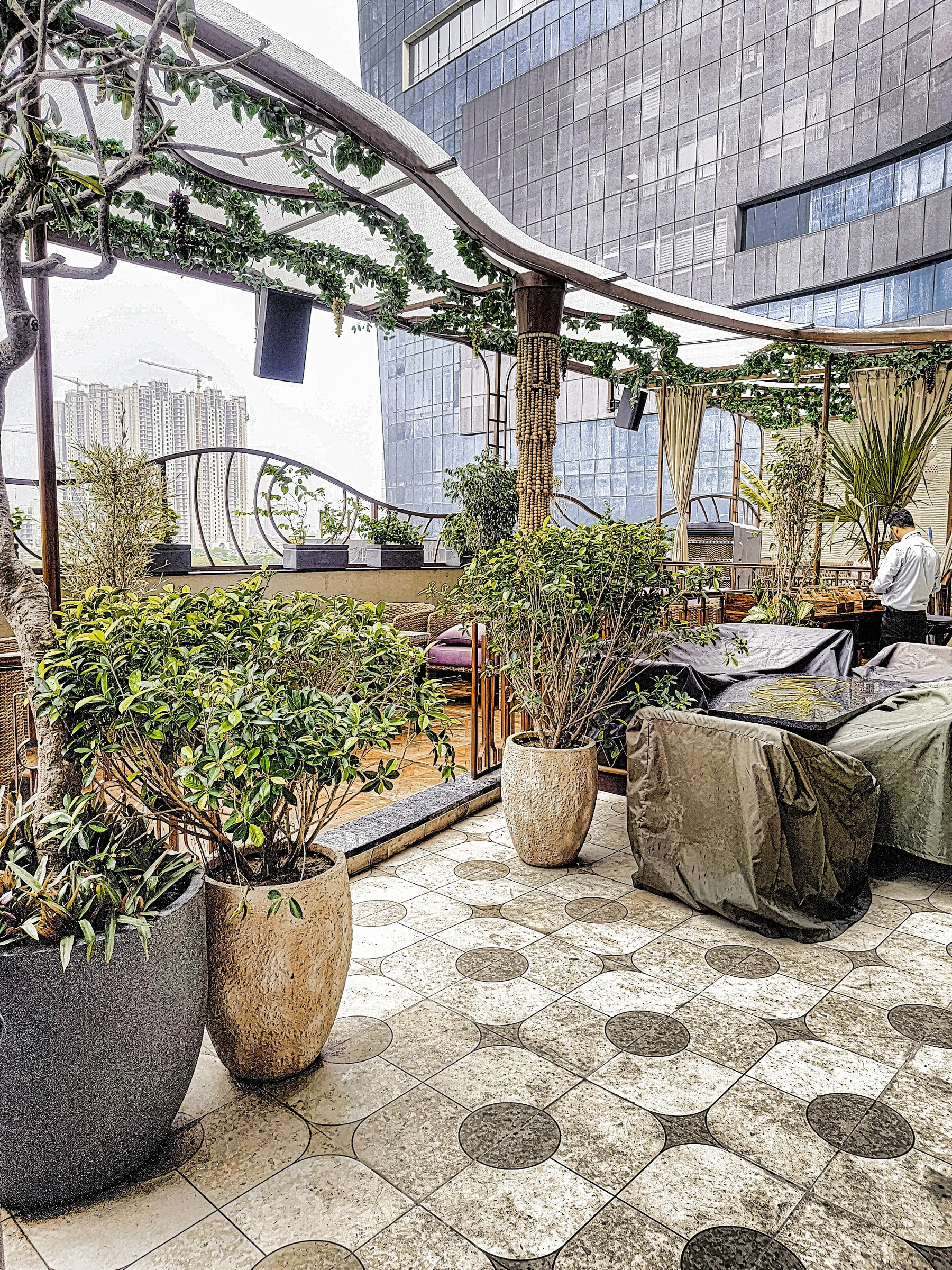 Landscape planting around dining seating at a luxury restaurant in Greater Noida